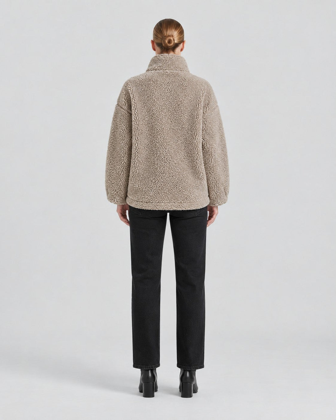 Luna Moda Anastasia beige fleece coat with a loose fit, shown from the back on a model wearing black jeans.