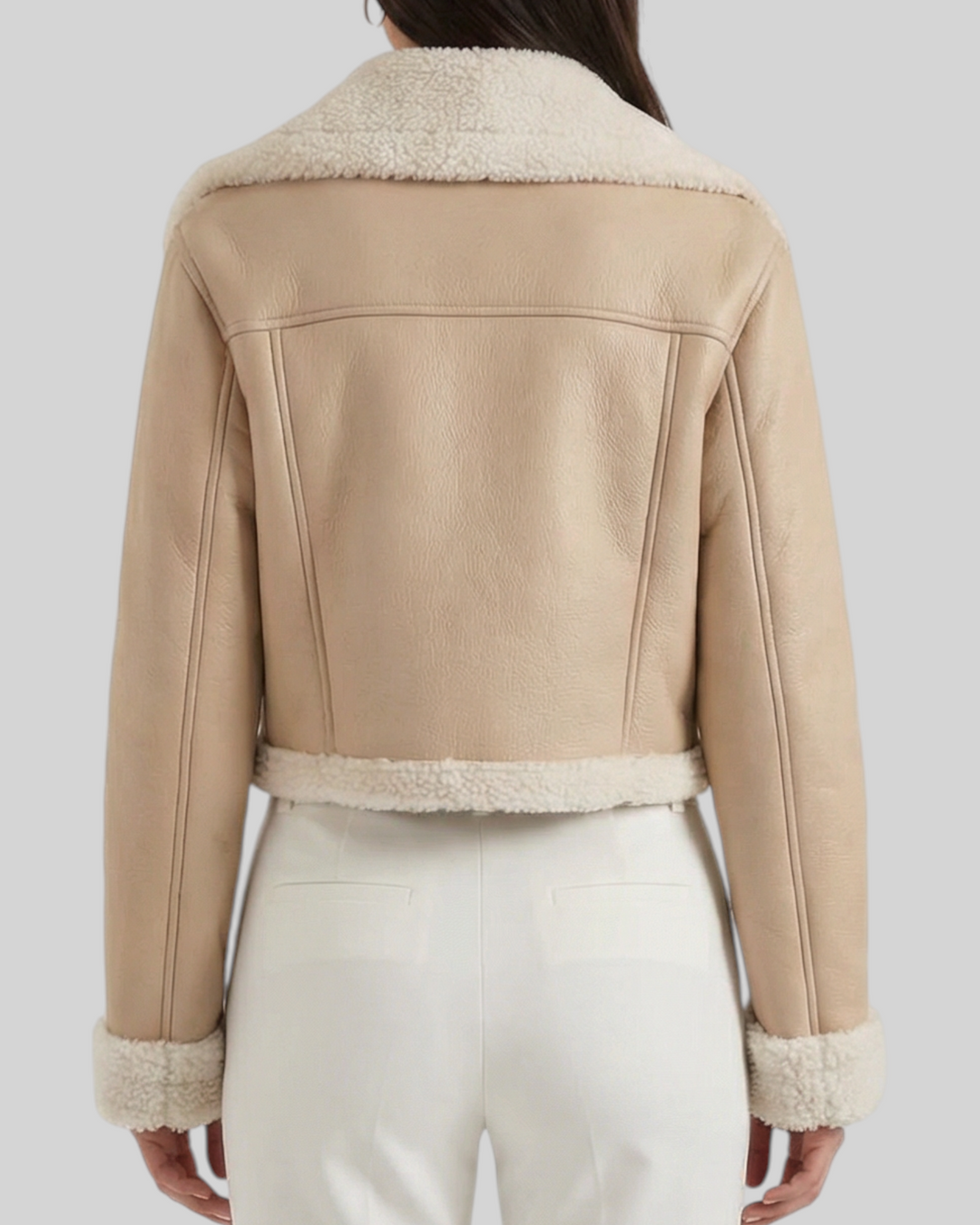 Luna Moda Mariella beige cropped jacket with faux shearling lining worn by a model from the back view