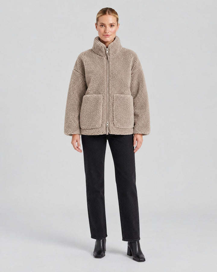 Luna Moda Anastasia beige fleece zip-up jacket with pockets worn by a model against a neutral background