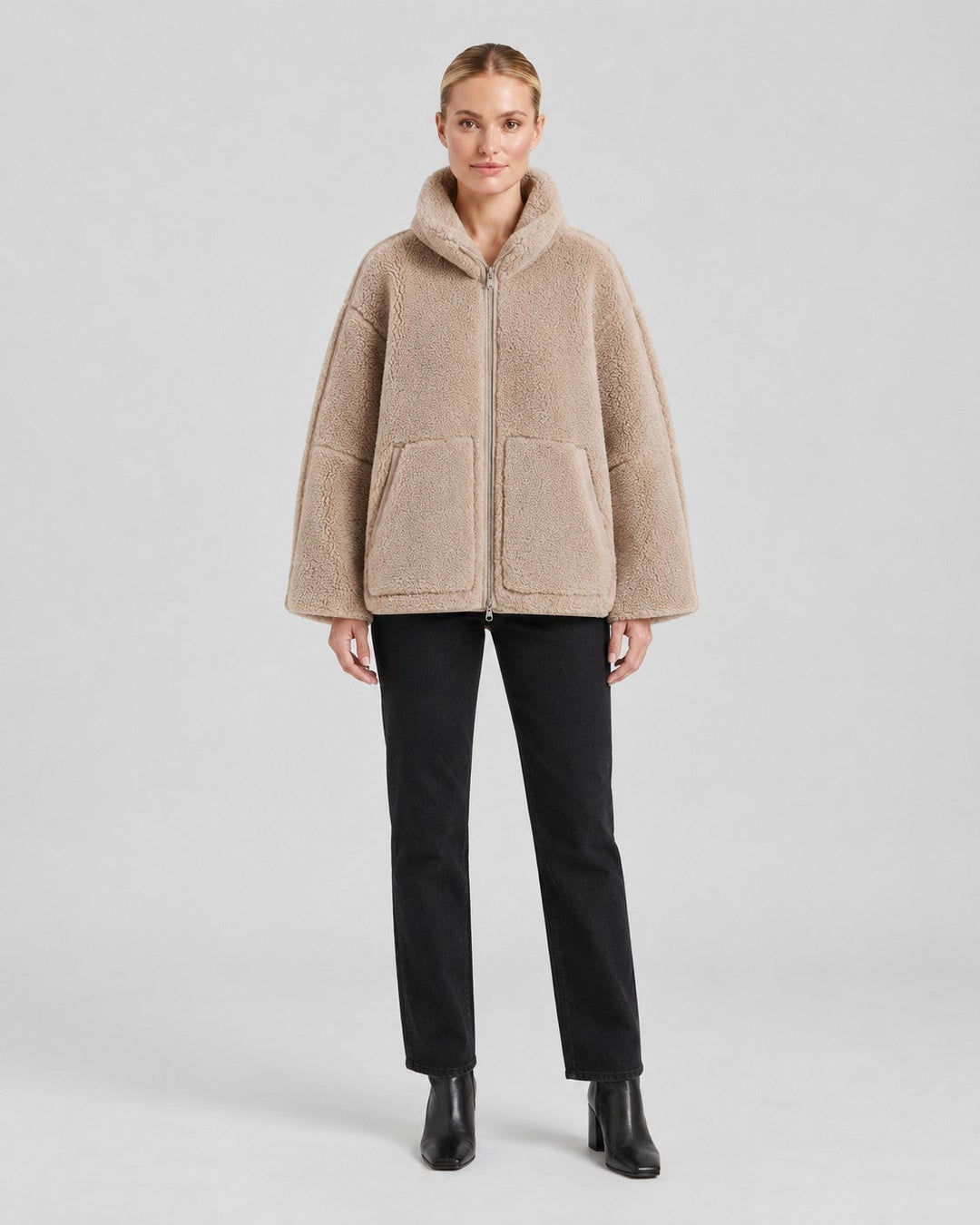 Luna Moda Anastasia beige fleece zip-up coat with hood and pockets worn by a model with black jeans