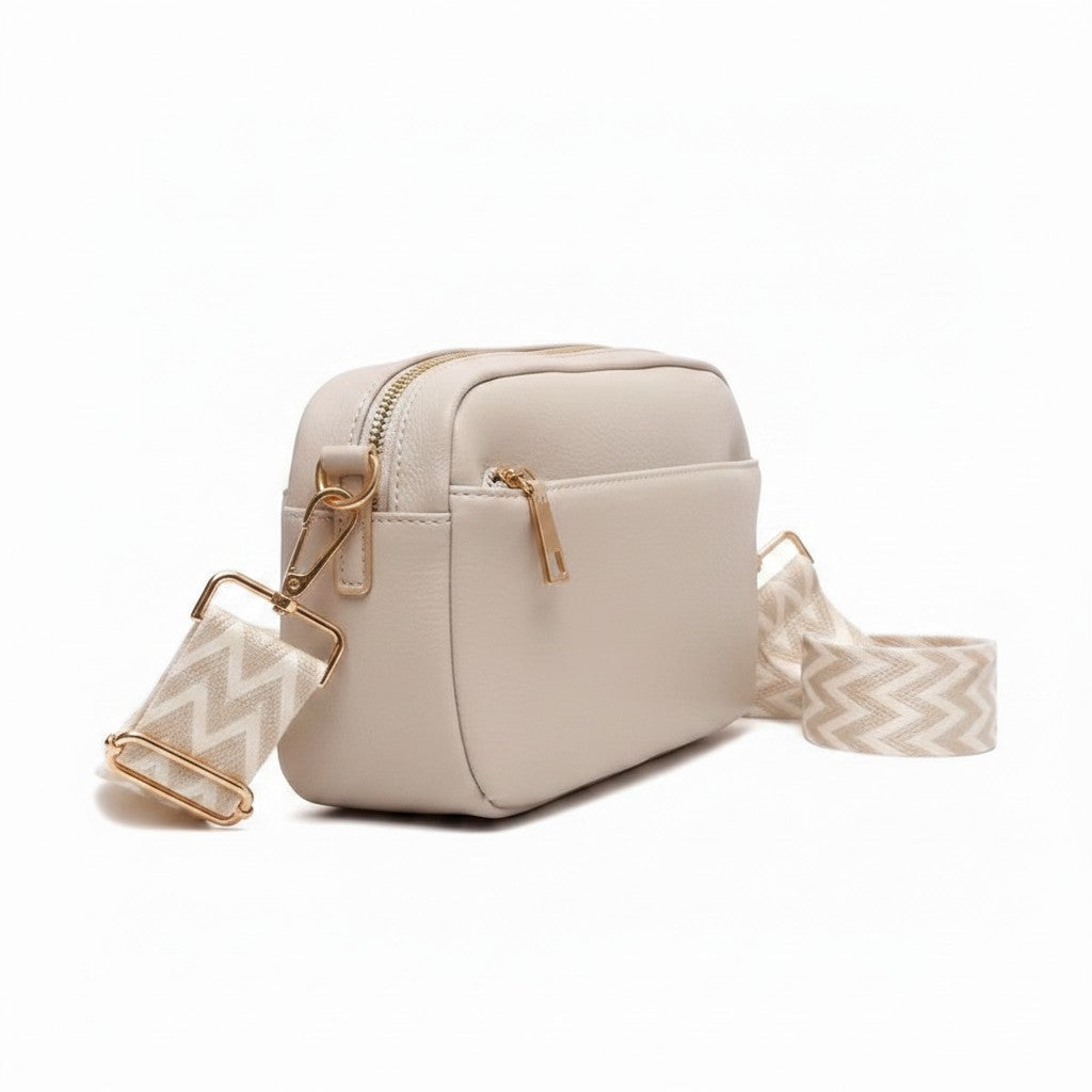 Luna Moda beige geometric crossbody bag with gold hardware and a patterned chevron strap