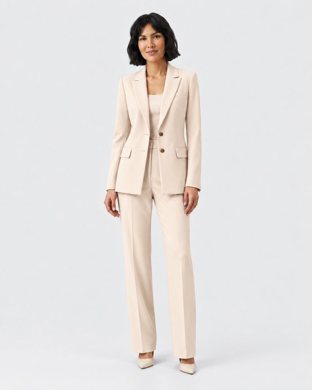 Luna Moda beige structured blazer and tailored trouser suit worn by a woman for a sophisticated professional look.