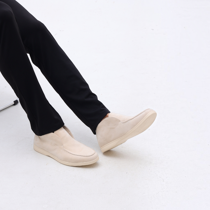 Luna Moda beige suede loafers with stitched upper and leather insole worn with black trousers