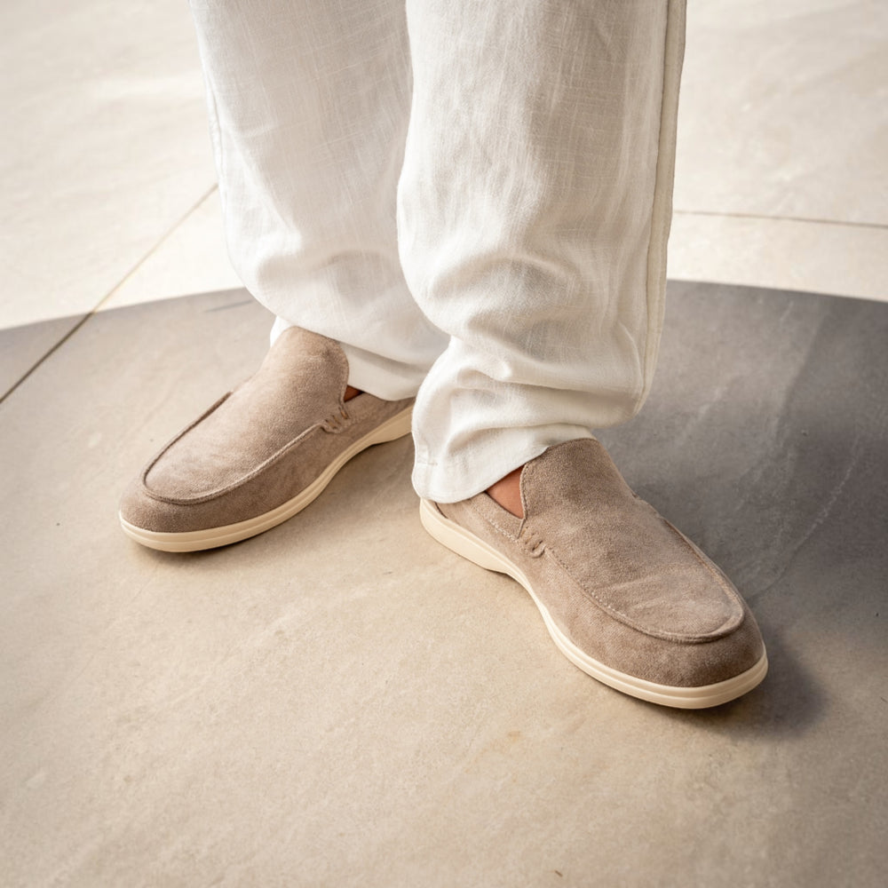 Luna Moda beige suede moccasins with supportive inner sole worn with white linen trousers on a stone floor