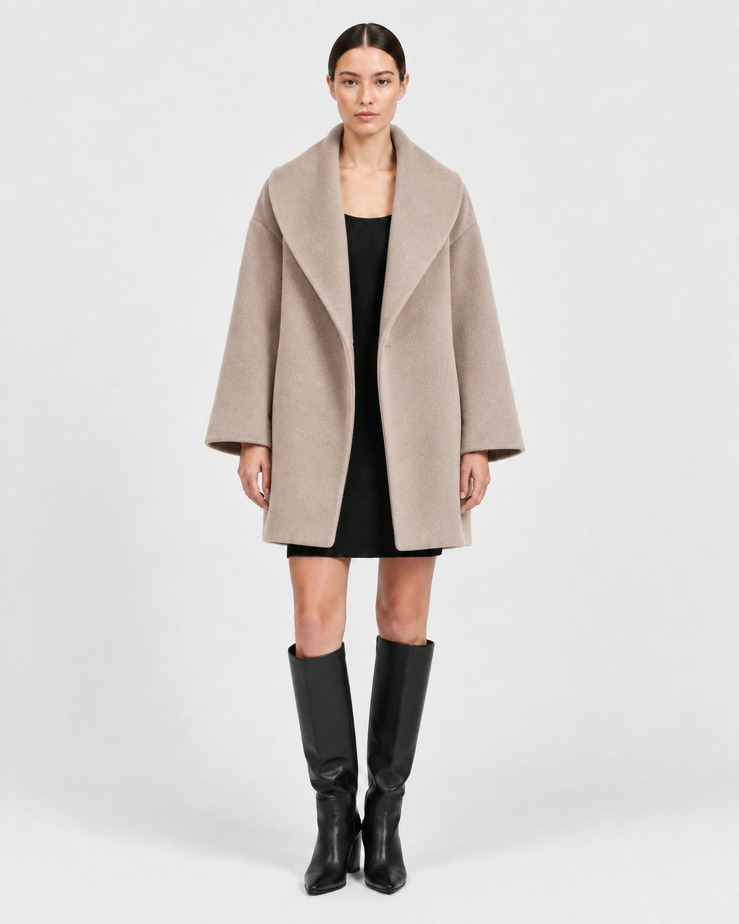 Luna Moda beige wool-blend coat with a wide collar worn by a model over a black dress and knee-high boots