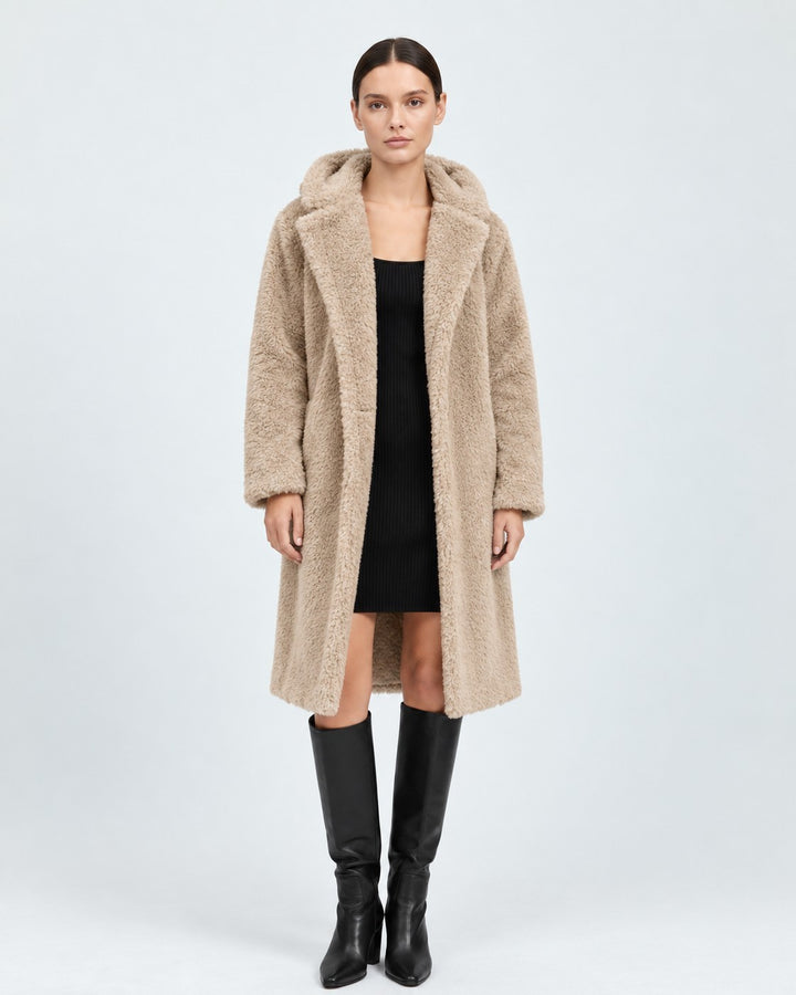 Luna Moda beige wool hooded coat with knee-length cut worn over a black dress and tall boots