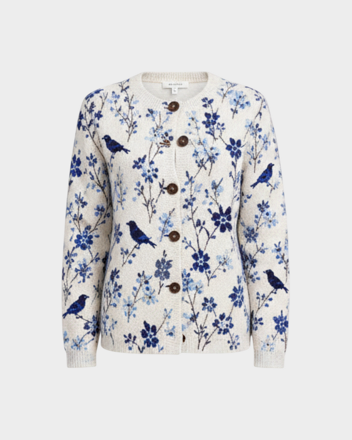 Luna Moda Benedetta cardigan in cream with a vintage blue bird and floral print, featuring wooden-style front buttons.