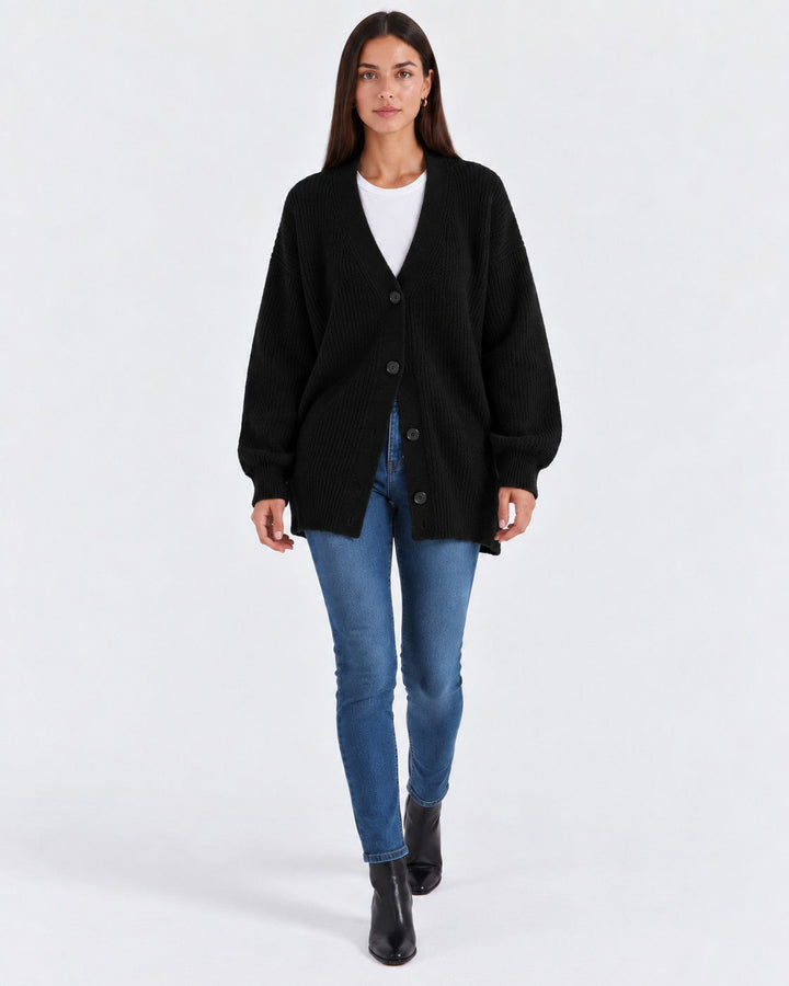 Luna Moda black cashmere V-neck cardigan worn by a woman with blue jeans and black boots