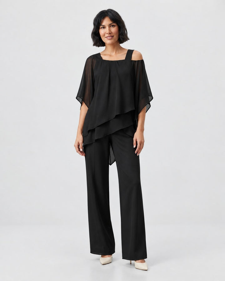 Luna Moda black chiffon evening set with a modern layered top and wide-leg trousers worn by a woman