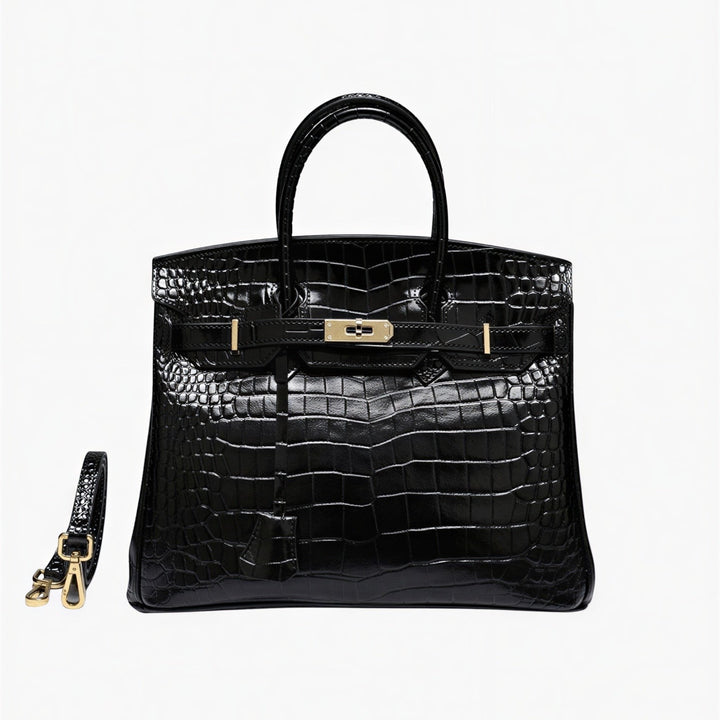 Luna Moda Isla black crocodile embossed leather structured tote bag with gold buckle hardware and shoulder strap.