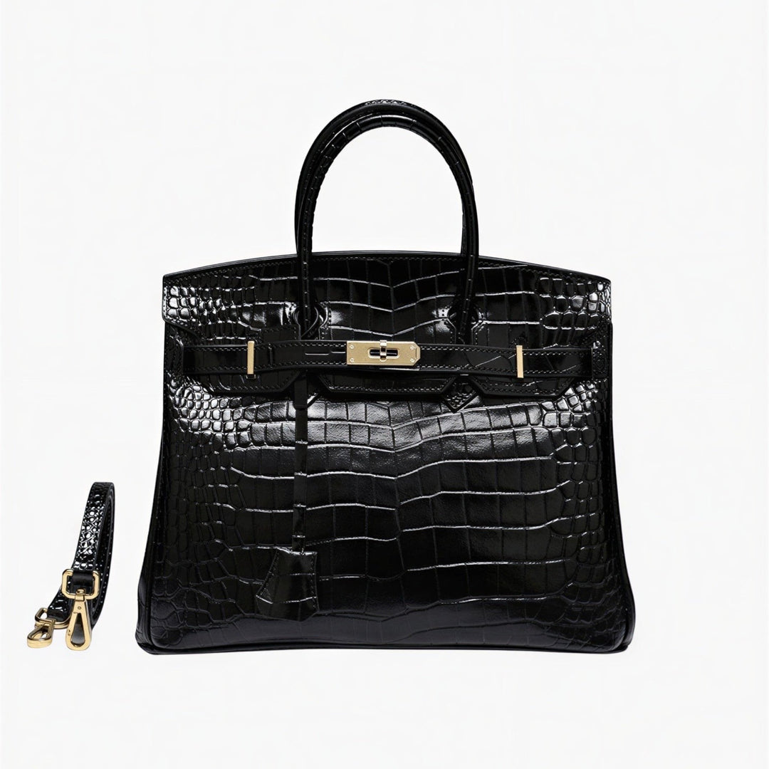 Luna Moda Ludovica black crocodile embossed leather structured tote bag with gold buckle hardware and shoulder strap.