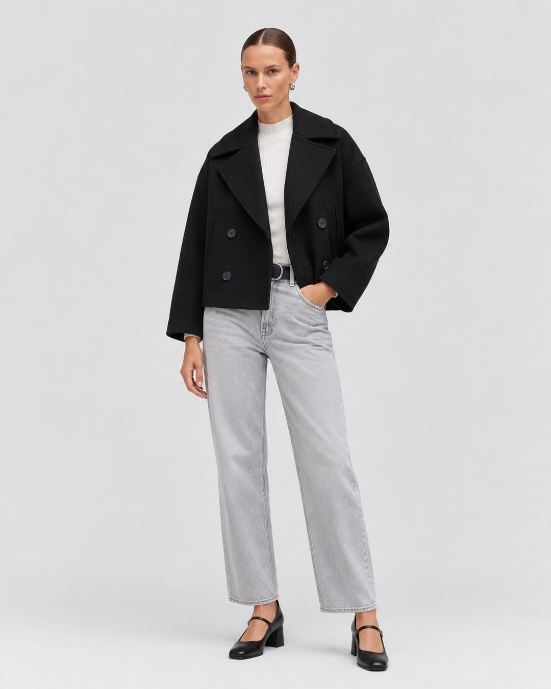 Luna Moda black double-breasted cropped jacket worn by a model with light wash jeans and black heels