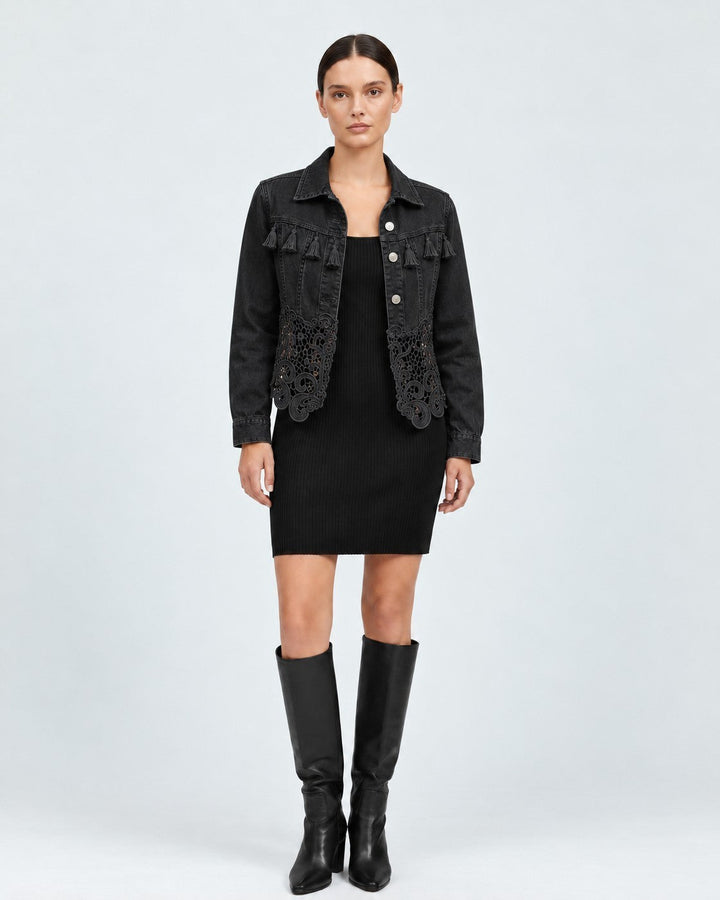 Luna Moda black denim jacket with fringe chest detail and lace hem worn over a black dress with knee-high boots