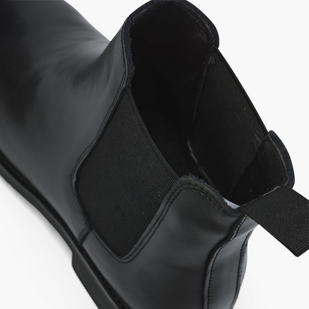 Luna Moda black leather Chelsea boot with elastic side panel and pull tab, showing a sleek slip-on design.