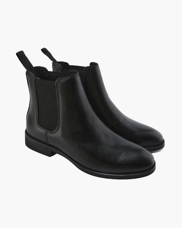 Luna Moda black leather Chelsea boots with elastic side panels and pull tabs for a sleek, versatile slip-on style.