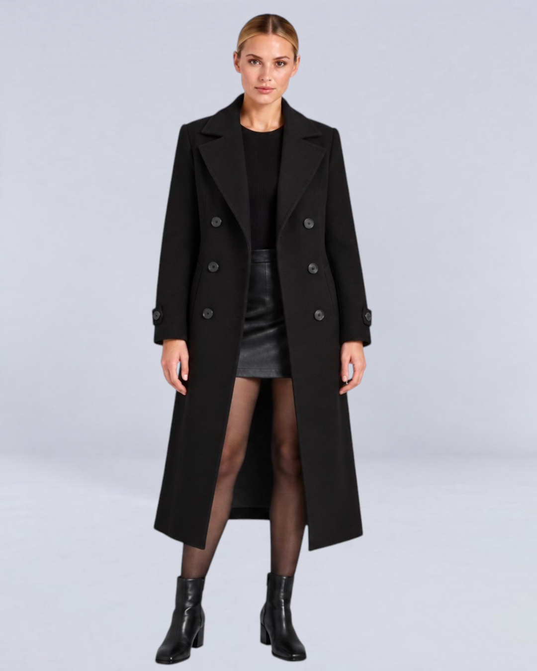Model wearing a Luna Moda black double-breasted long coat with a structured fit and classic lapels