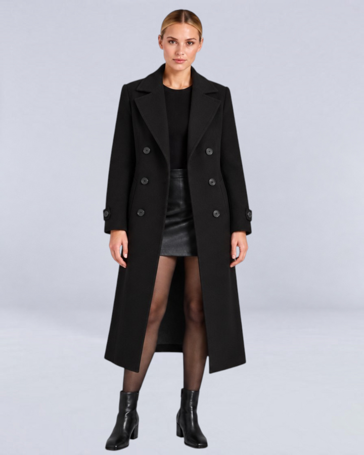 Model wearing a Luna Moda black double-breasted long coat with a structured fit and classic lapels