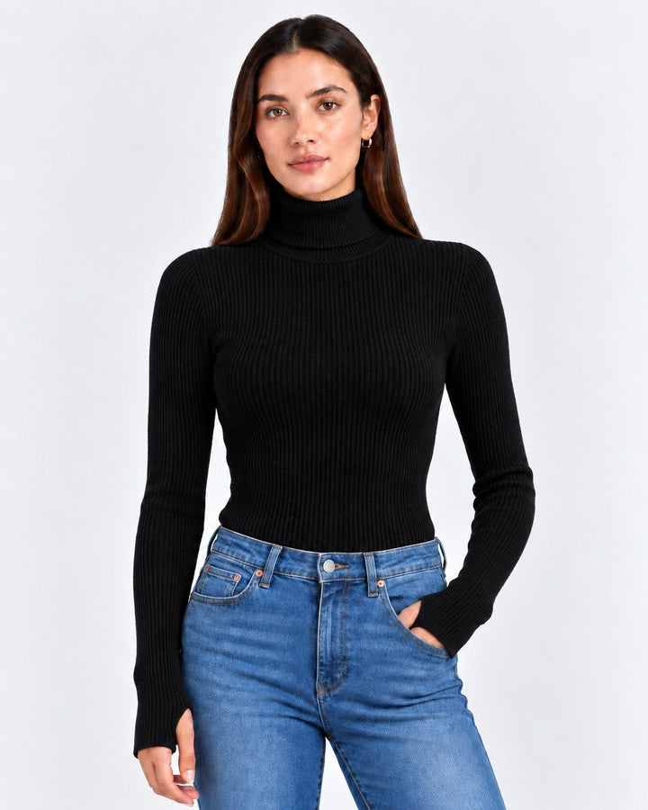 Model wearing a Luna Moda black ribbed turtleneck sweater with long sleeves paired with blue jeans