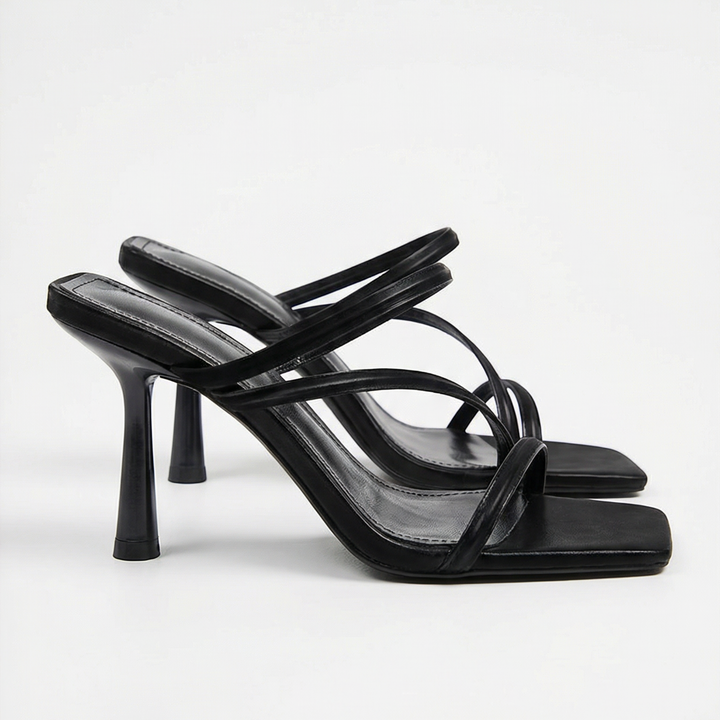 Luna Moda black strappy mules with thin cage-style straps, square toe, and high stiletto heel.