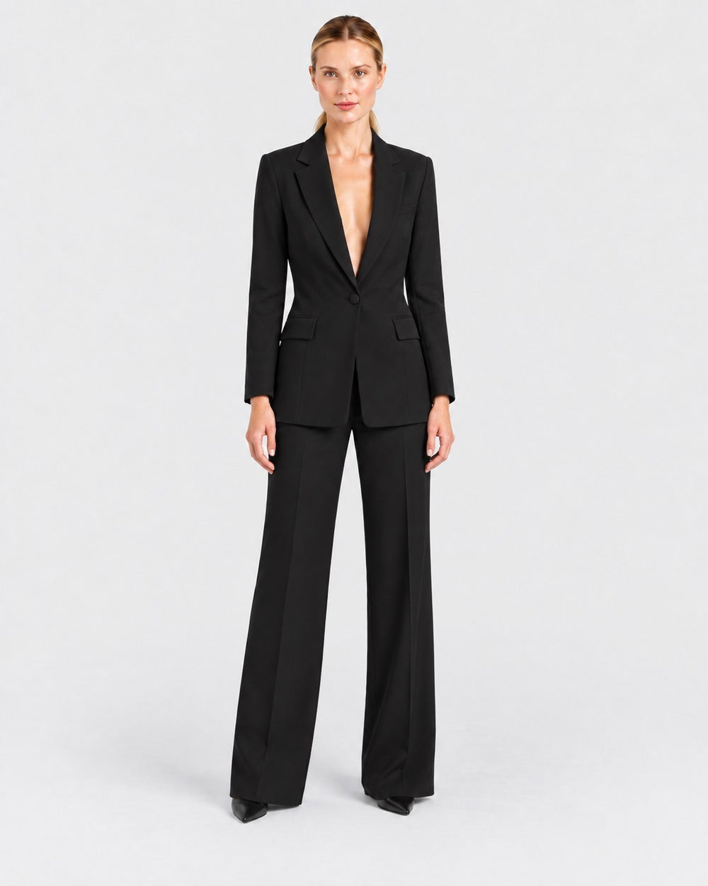 Luna Moda black structured blazer and straight-leg trouser suit worn by a model on a neutral background.