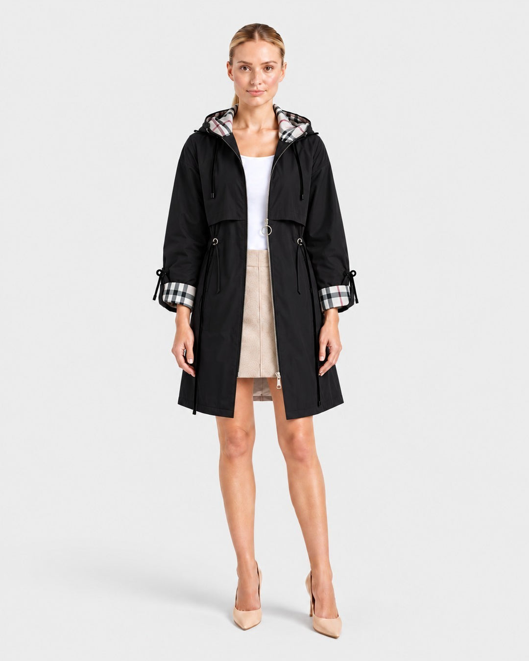 Luna Moda ROSMUNDA black lightweight windbreaker jacket with plaid hood lining and cinched waist on a model