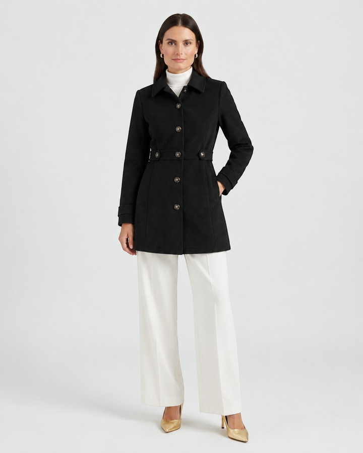 Luna Moda black wool-blend short coat with button closure, worn by a model with white trousers and heels.