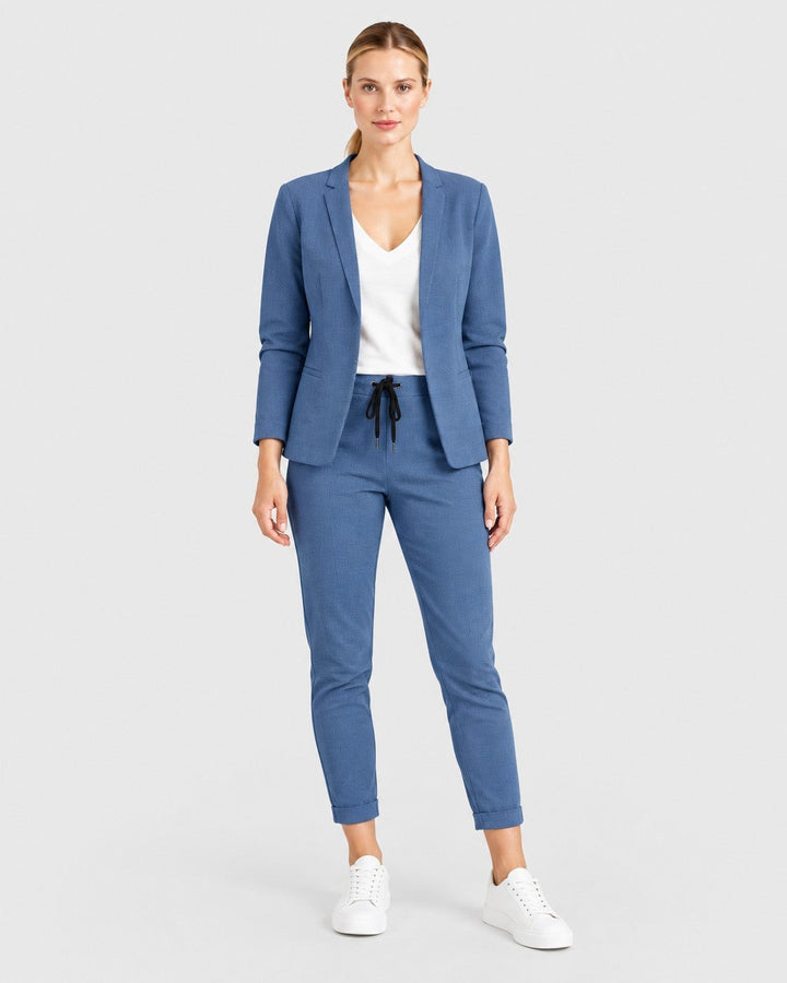 Luna Moda blue lightweight blazer and drawstring trouser set worn by a model with a white top and sneakers