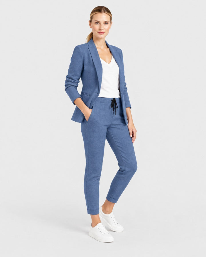 Luna Moda blue blazer and drawstring trouser set worn by a woman with white sneakers for a casual chic look.