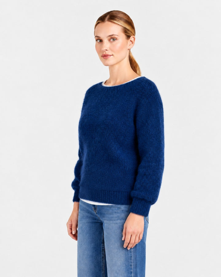 Luna Moda Elda crew neck sweater in deep blue, featuring a soft, fuzzy knit texture worn by a woman.