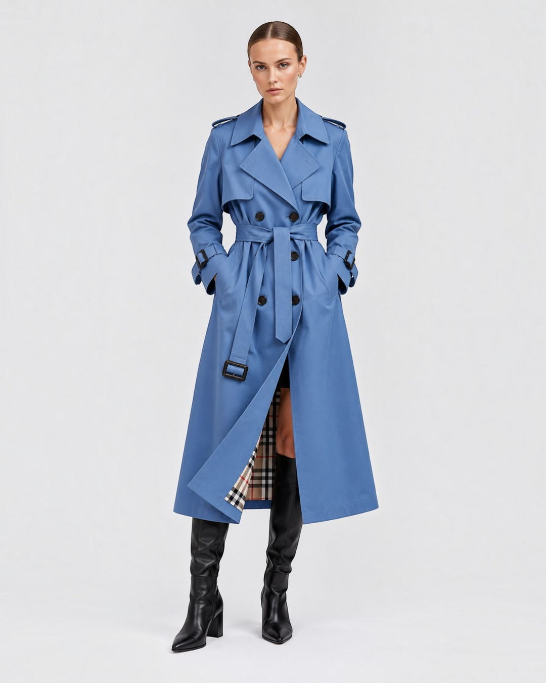 Luna Moda blue double-breasted trench coat with waist belt and plaid lining worn by a model with black boots