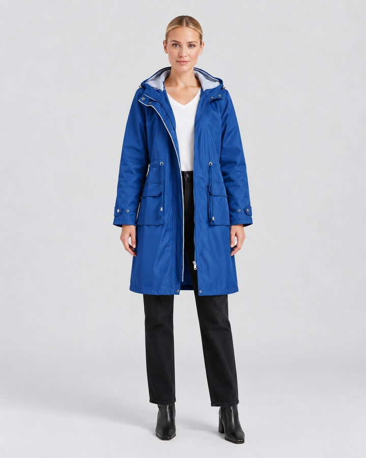 Luna Moda blue lightweight hooded trench coat with adjustable waist and elastic cuffs worn by a model