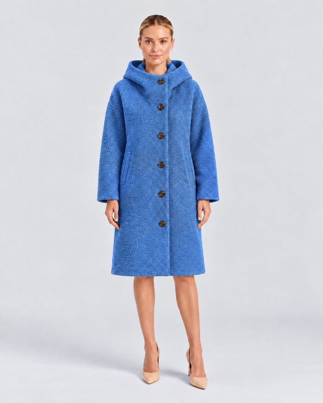 Luna Moda Adelaide blue textured wool coat with a high collar and hood worn by a model