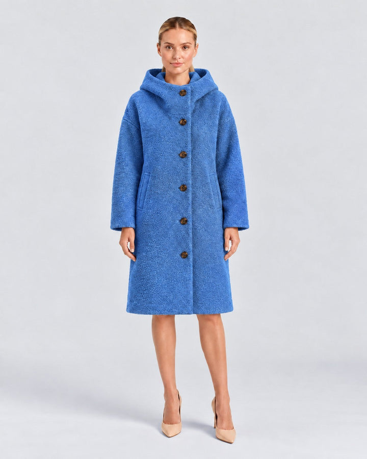 Luna Moda Adelaide blue textured wool coat with a high collar and hood worn by a model