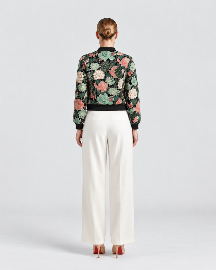 Luna Moda Sofia botanical print bomber jacket worn with white trousers, back view