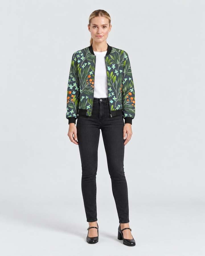 Luna Moda Sofia bomber jacket with a dark green botanical print featuring orange berries and light blue flowers