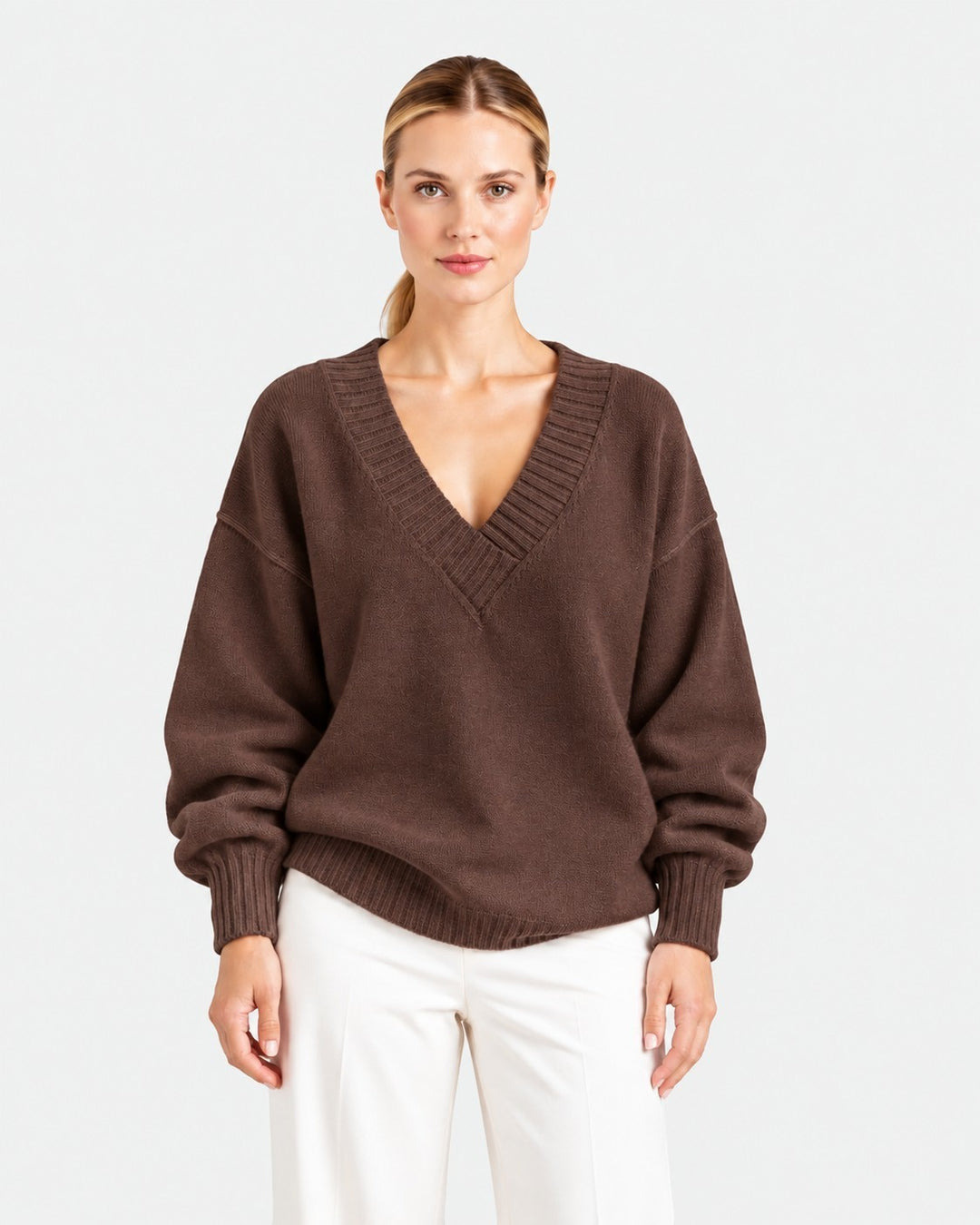 Luna Moda brown relaxed fit cashmere blend sweater with a deep V-neck and long sleeves worn by a woman