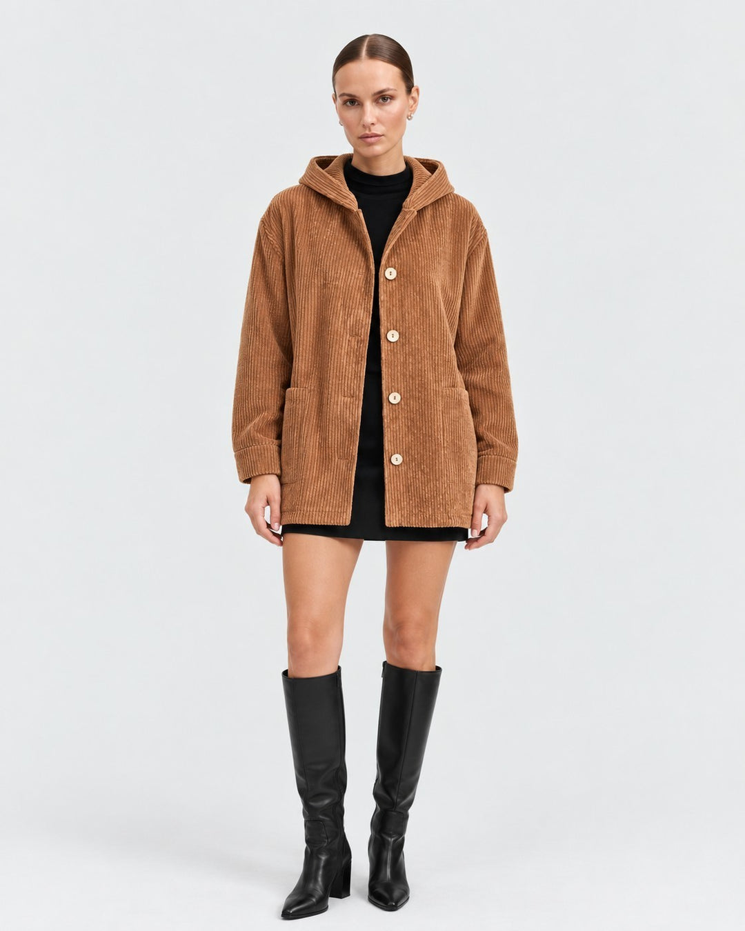 Luna Moda brown corduroy hooded jacket with front buttons worn by a model with a black dress and knee-high boots