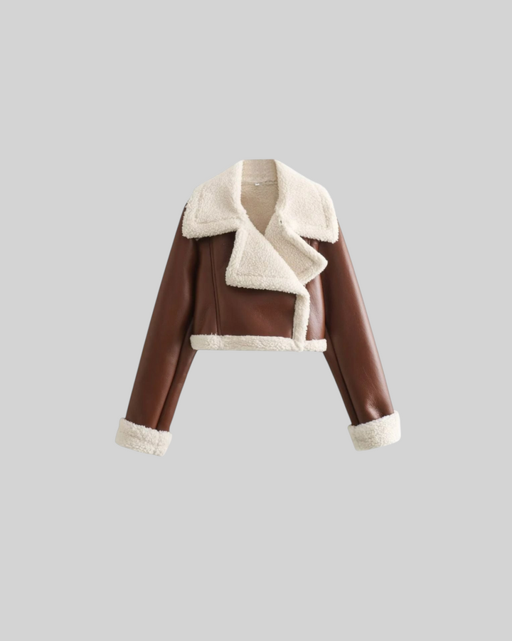 Luna Moda cropped brown faux leather jacket with a soft white fleece collar and cuffs for a stylish winter look.