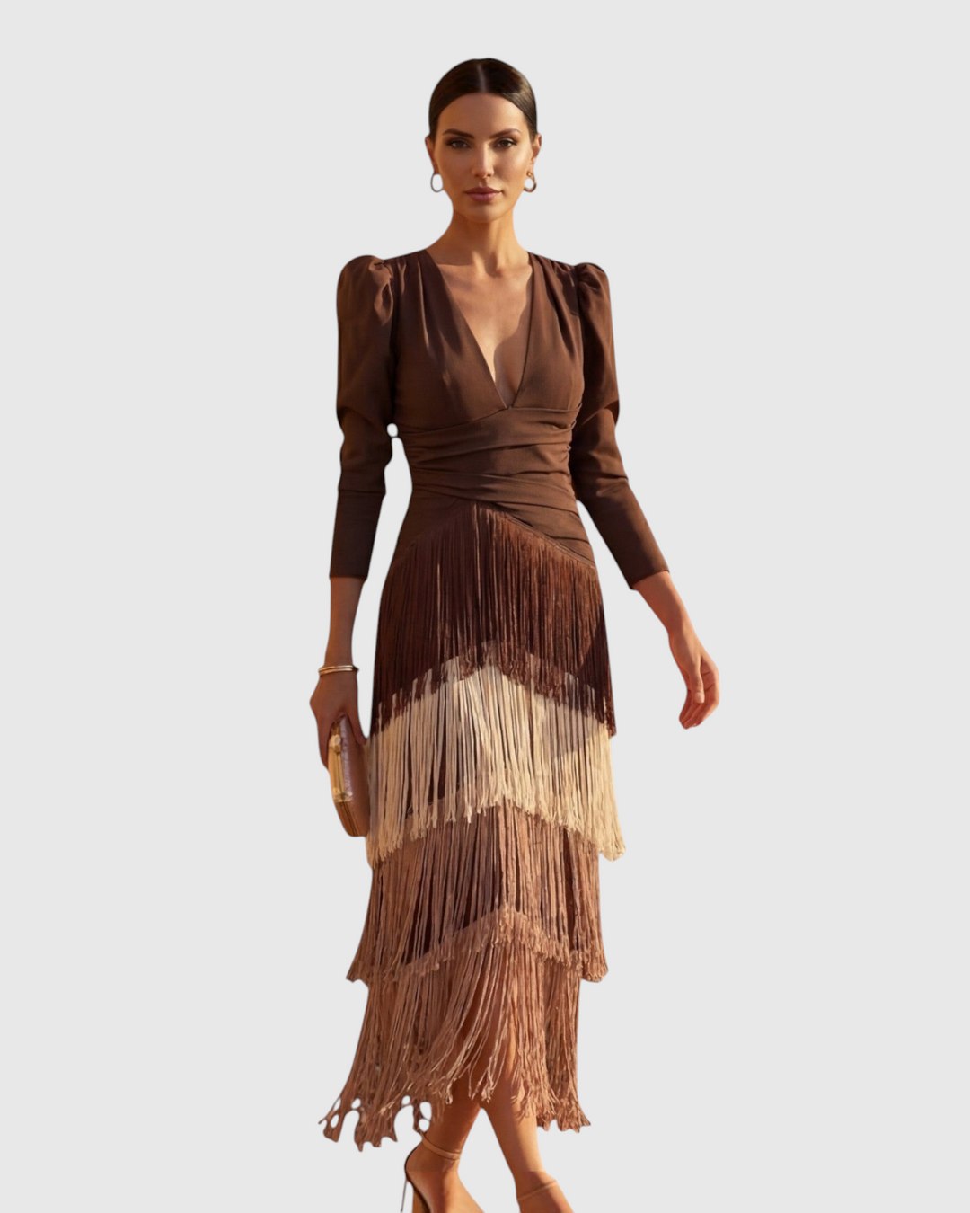 Luna Moda brown midi dress with V-neck, draped waist, and tiered fringe skirt worn by a model in a studio.