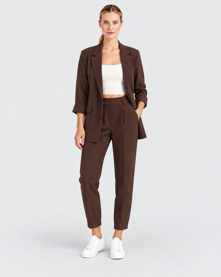 Luna Moda Cornelia oversized brown suit with fluid trousers and buttoned blazer worn by a model with white sneakers