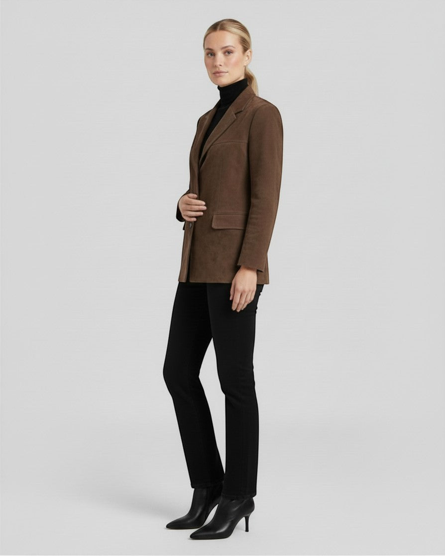 Luna Moda Marta brown suede blazer worn by a woman with a black turtleneck and trousers, side view.