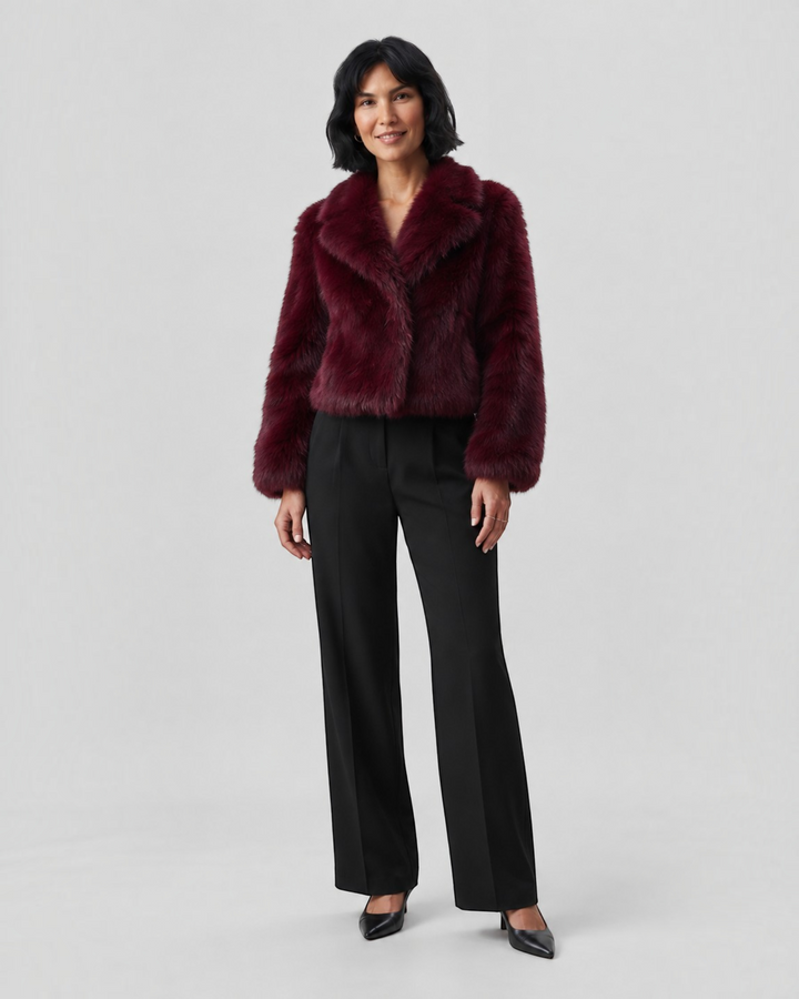 Luna Moda burgundy faux fur jacket with wide collar worn by a model with black trousers and heels