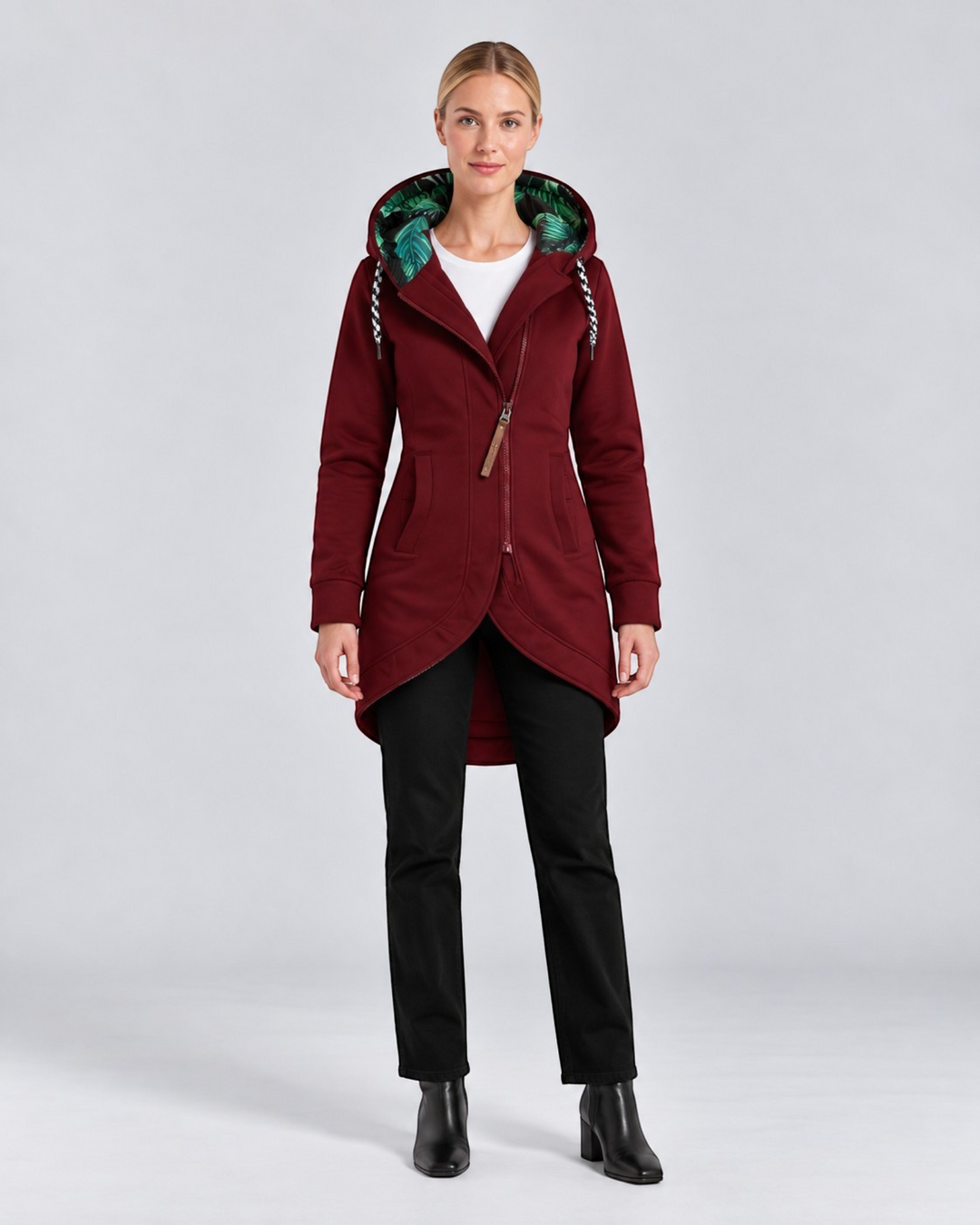 Luna Moda burgundy hooded coat with asymmetrical zip, green leaf print lining, and high-low hem on a female model