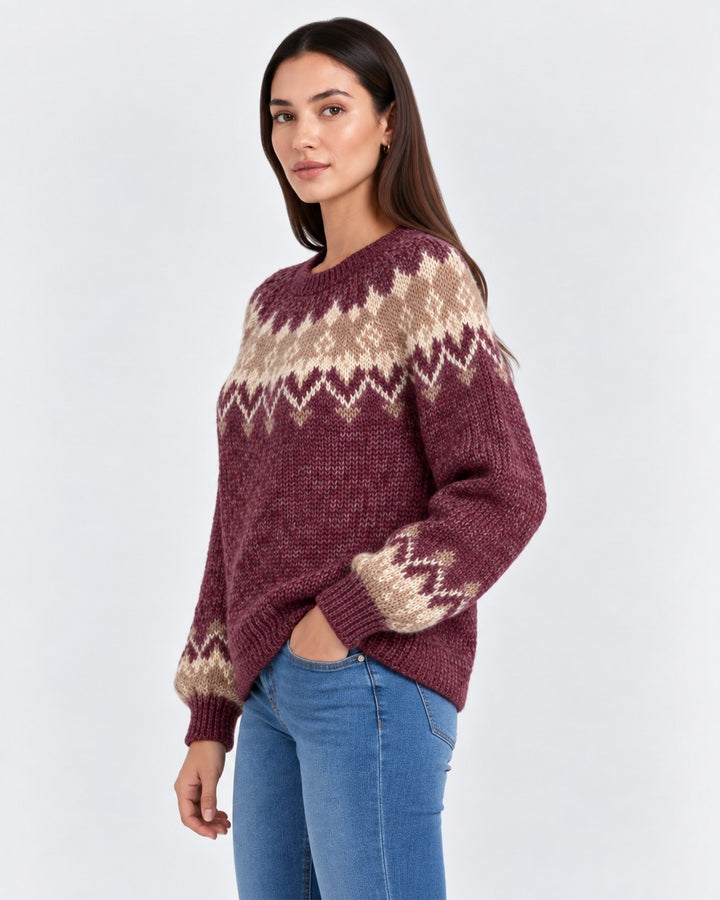 Luna Moda handmade knit sweater in burgundy and beige with a traditional Nordic pattern worn by a woman