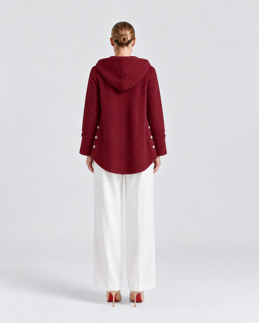 Luna Moda Susanna quilted burgundy hooded jacket with decorative side buttons, back view on a model