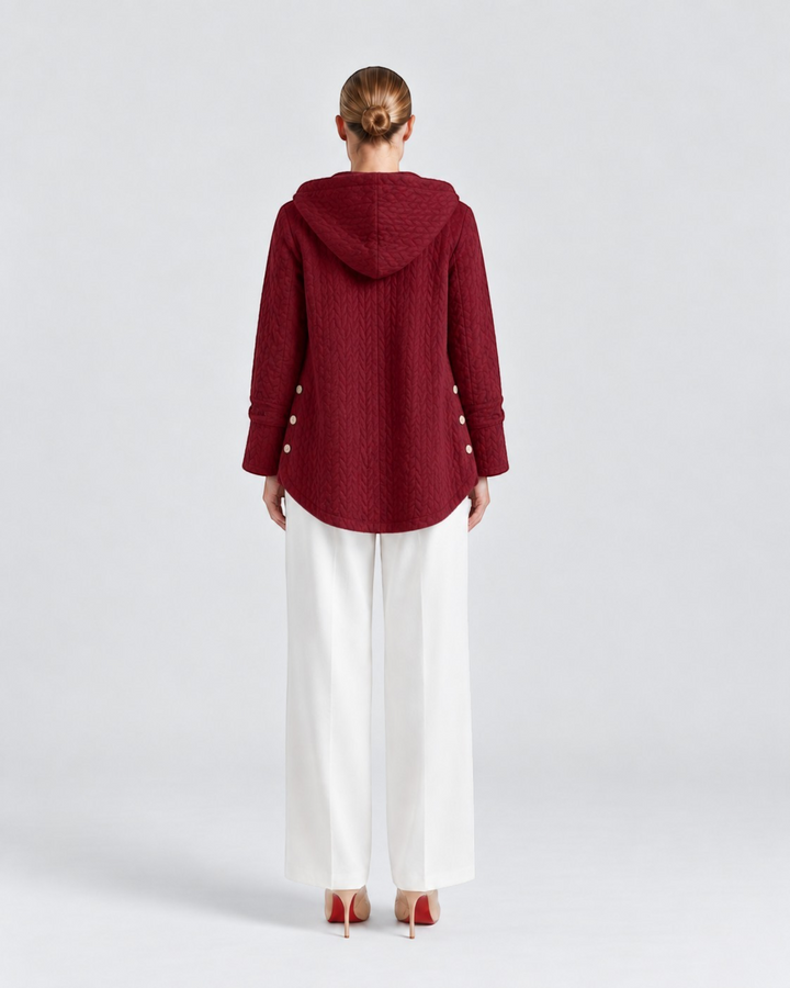 Luna Moda Susanna quilted burgundy hooded jacket with decorative side buttons, back view on a model
