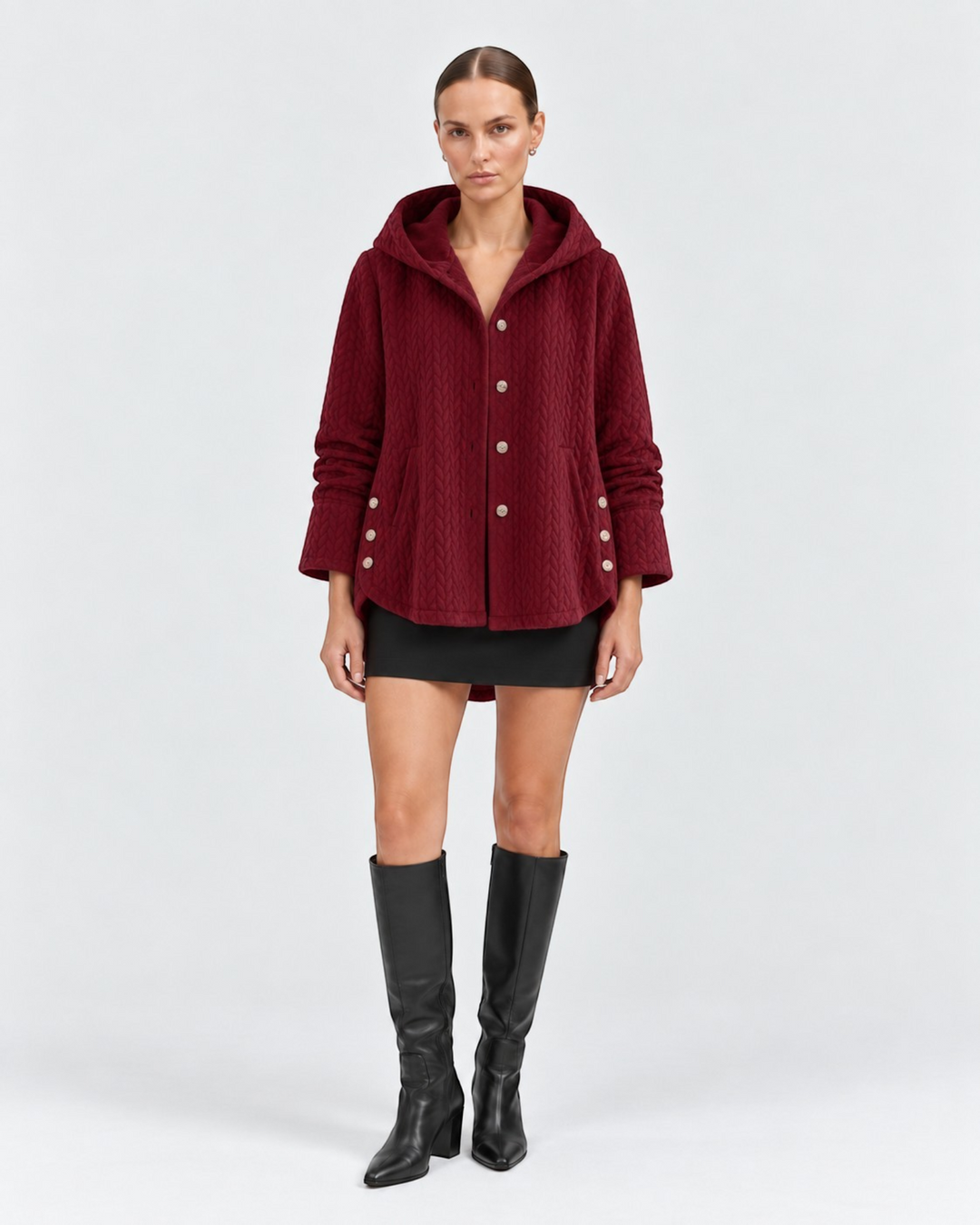 Luna Moda burgundy quilted hooded jacket with decorative side buttons worn by a model with a black skirt and boots
