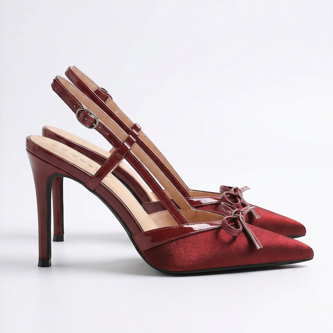 Luna Moda burgundy satin pointed-toe stiletto heels with a T-strap, adjustable buckle, and delicate bow detail.
