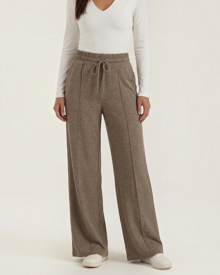 Luna Moda high-waisted palazzo pants in brown with an elastic drawstring waist, front seams, and wide-leg fit.