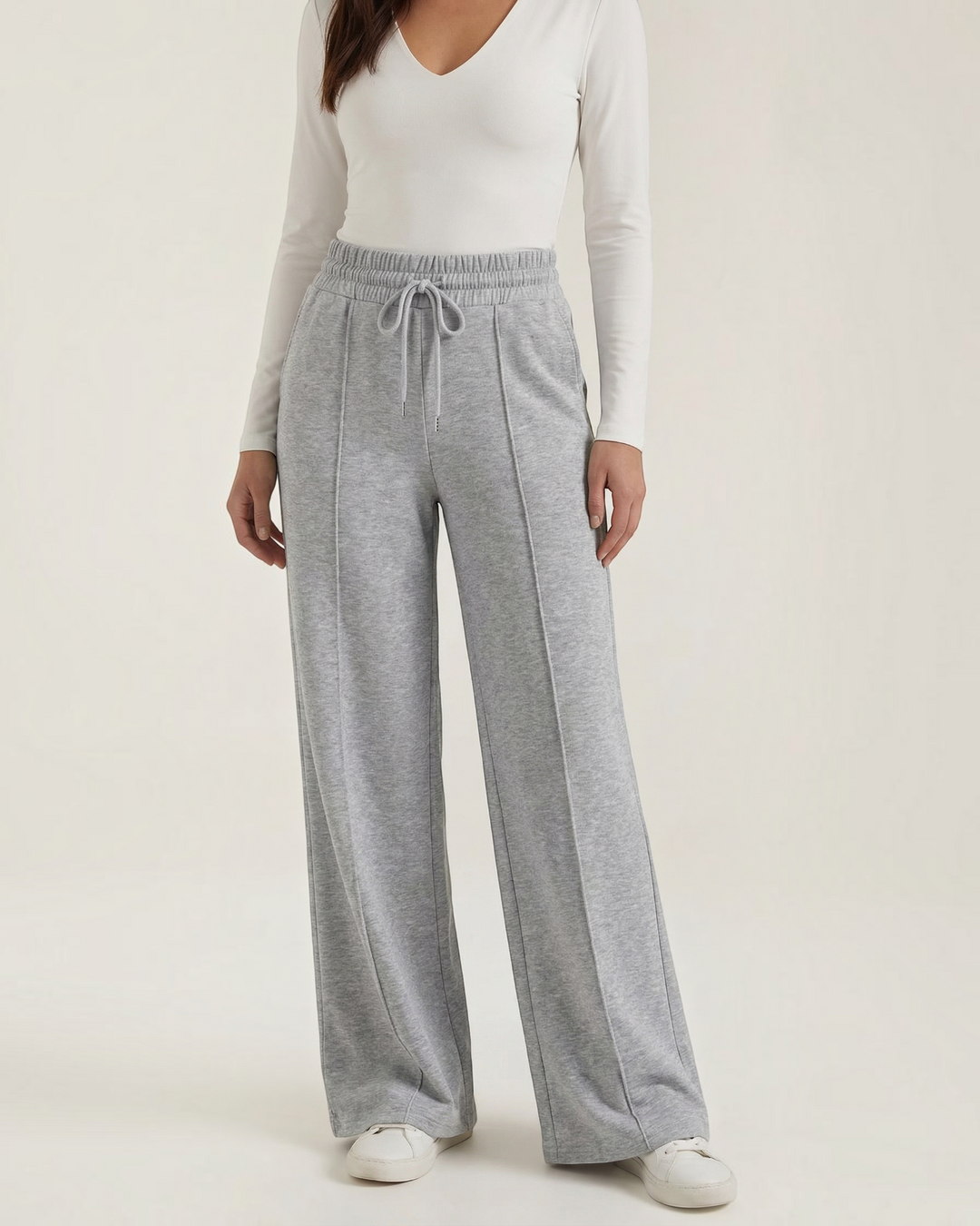Luna Moda high-waisted grey palazzo pants with drawstring waist, wide legs, and front seam detailing on a model.
